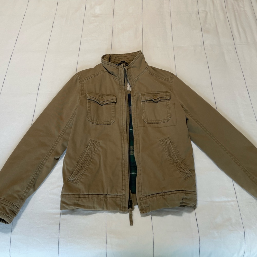 American Eagle Khaki Colored jacket w/ plaid inner lining.